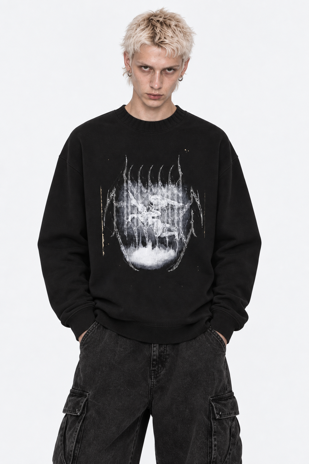 Model in the black knit crewneck with the white distressed graphic print, front view.