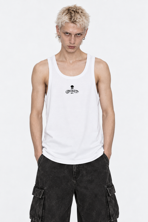 Model in the white ribbed tank top with the small black Flawless skull logo, front view.